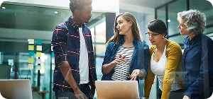 creative business people with laptop meeting as web designer teamwork collaboration ideas project group employee digital technology planning information company